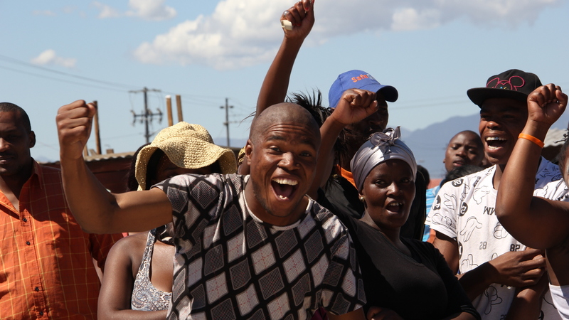 Shack dwellers celebrate as eviction squad pulls back