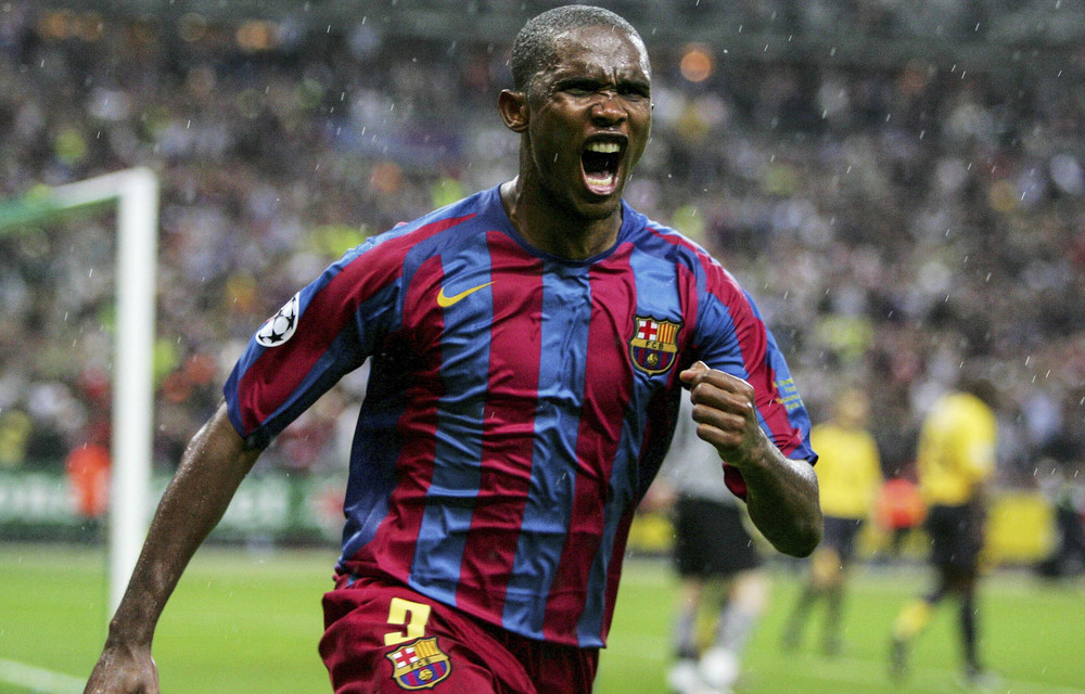 Samuel Eto'o celebrates a goal in a Barcelona shirt