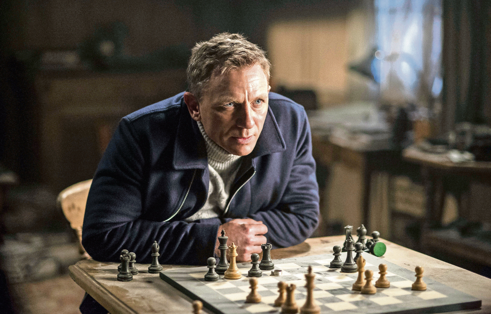 Daniel Craig comes out guns blazing after miraculously escaping a plan crash in Spectre.