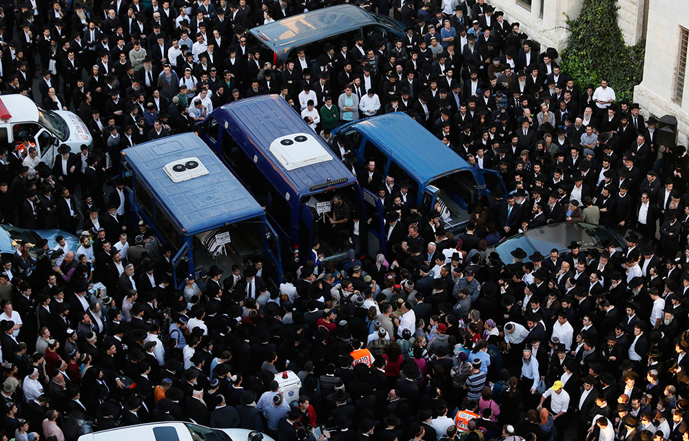 Ultraorthodox Jews mourn the men who were killed by two Palestinians at a synagogue in Jerusalem this week.