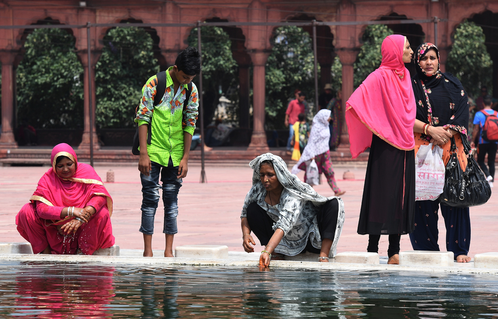 Indian Muslim women perform ablution at the Jama Masjid mosque in New Delhi.