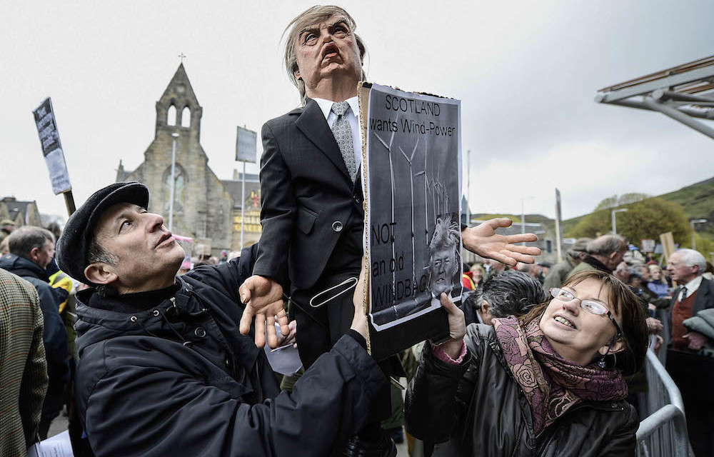 Then and now: Demonstrators outside the Scottish Parliament in 2012 after Donald Trump spoke of his concerns over a proposed wind farm. Photo: Jeff J Mitchell/Getty Images