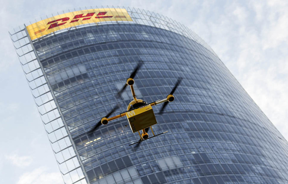 A prototype "parcelcopter" or modified drone belonging to German group Deutsche Post DHL flies in front of the company's headquarters in Bonn in December 2013.