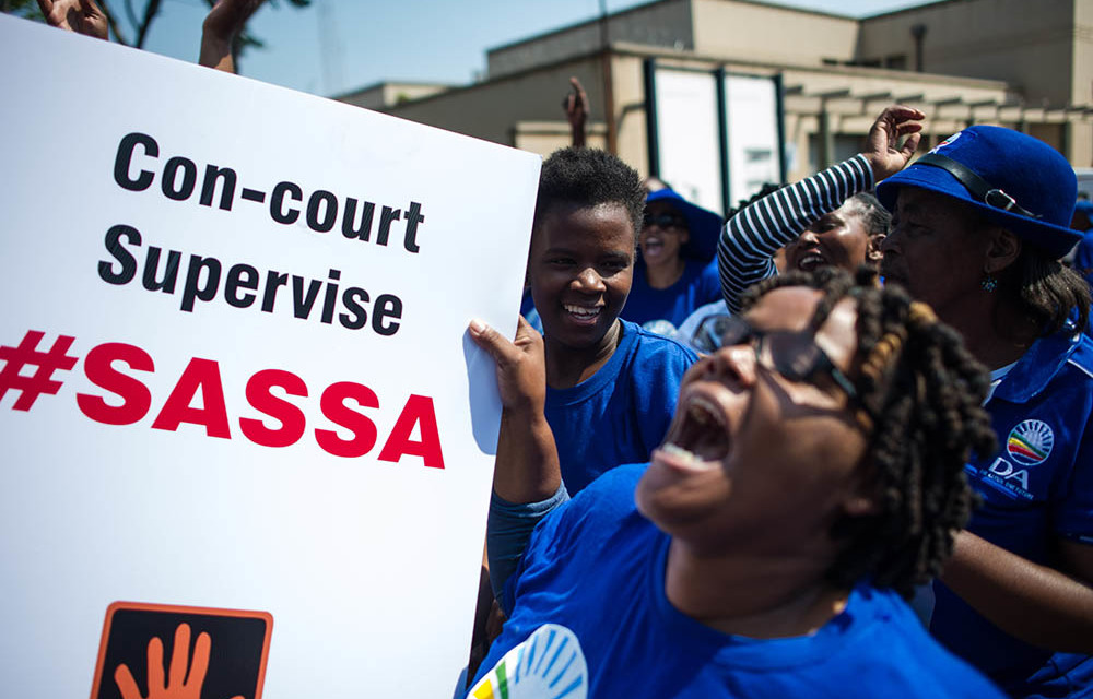 DA members at the Constitutional Court during a hearing on Black Sash's request for Sassa to use Cash Paymaster Services until a new grant payment system was in place.