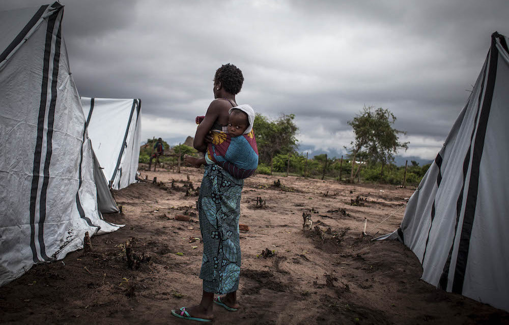 Sanctuary: A Mozambican woman and her child are among 3 000 people who have sought refuge in an internal displacement camp. Scores of people were killed in the country last year. Photo: John Wessels/AFP