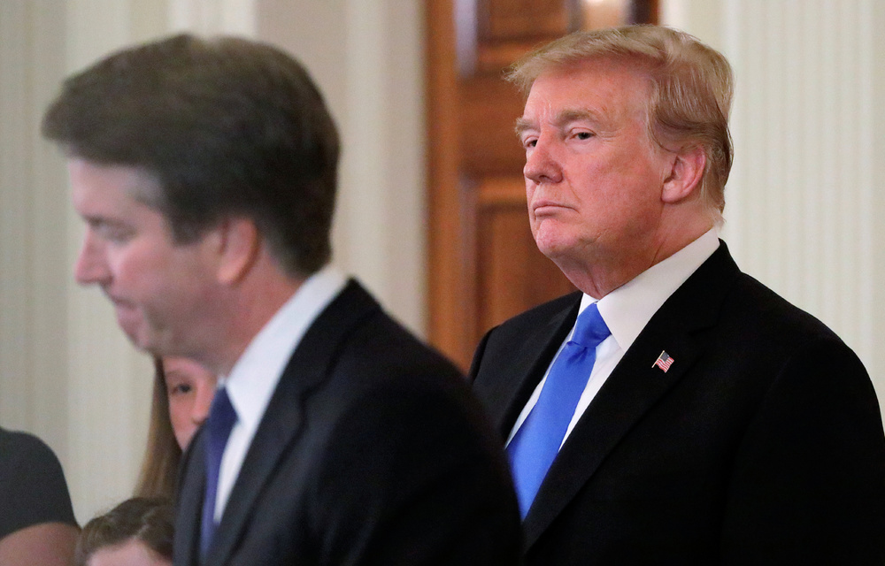 US President Donald Trump listens to his nominee for the US Supreme Court Brett Kavanaugh speak during his nomination announcement in the East Room of the White House in Washington.