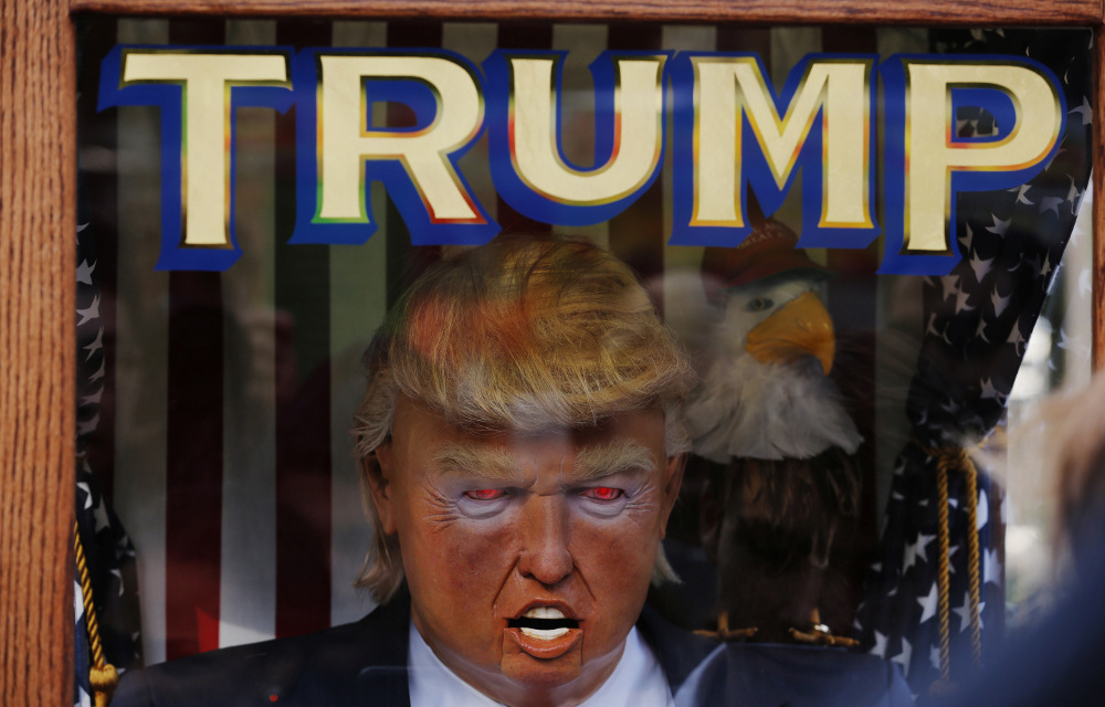 The likeness of Donald Trump stands inside of a themed fortune telling machine in Columbus Circle in New York