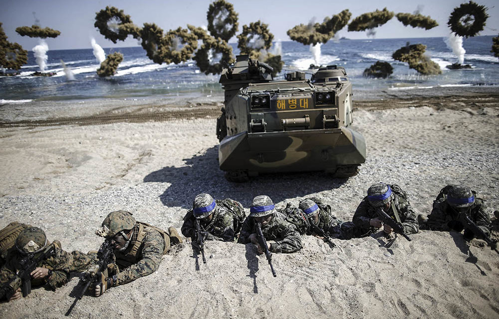 South Korean and US Marines take their positions as amphibious assault vehicles fire smoke bombs during a joint drill in Pohang earlier this year.