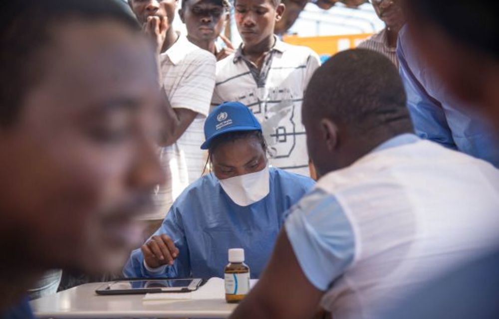 Nurses working with the World Health Organisation administer vaccines in Mbandaka.