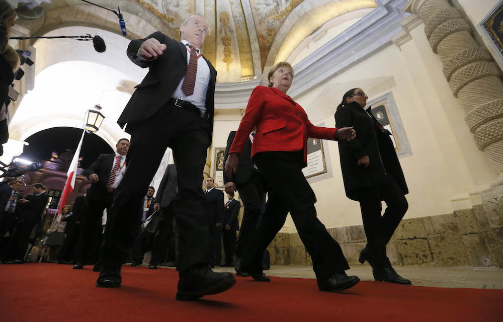 German Chancellor Angela Merkel leaves at the end of the European Union leaders summit in Valletta