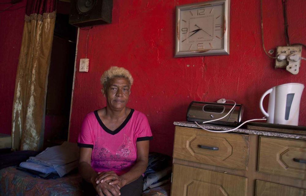 Riverlea residents like Faridea Appolis say that the dust resulting from a ­reclamation project at a nearby mine dump is making them sick.