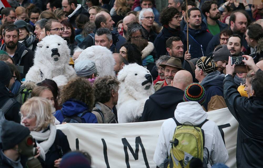 People take part in a march dubbed "Claim the Climate" demanding Belgian authorities to take action during the COP24