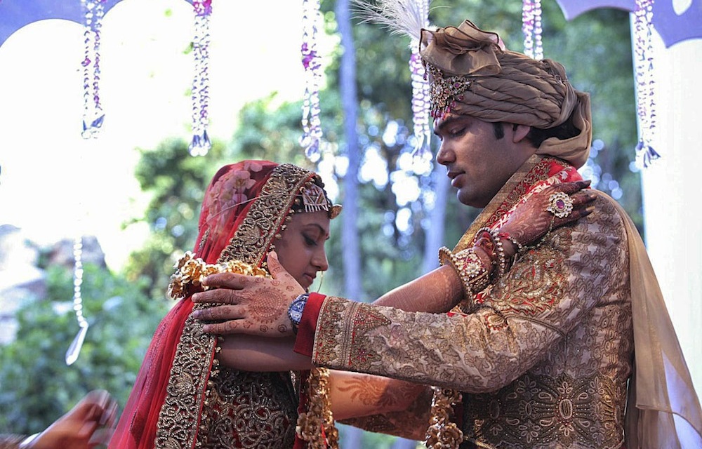 Family ties: Vega Gupta exchanges garlands with Aakash Jahajgarhia at their wedding