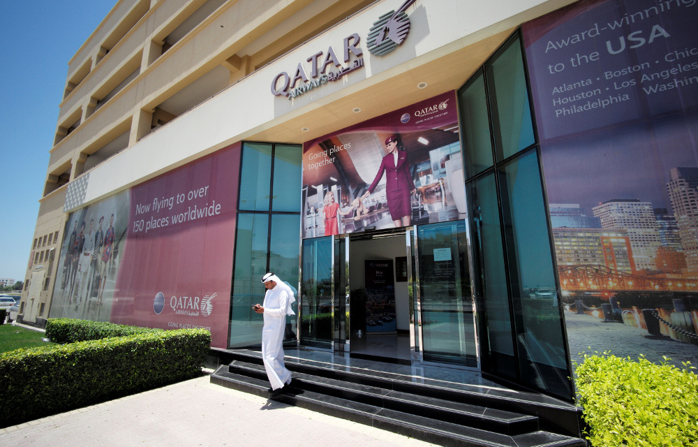 A man leaves Qatar Airways office in Manama