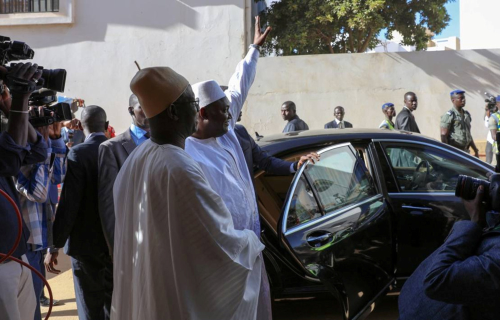 Gambia President Adama Barrow waves to well-wishers after his inauguration ceremony at the Gambian embassy in Dakar