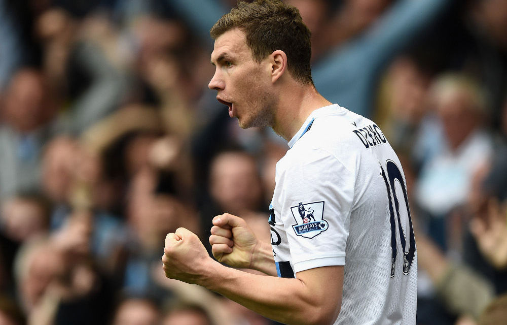 Edin Dzeko of Manchester City celebrates scoring his team's second goal against Everton.