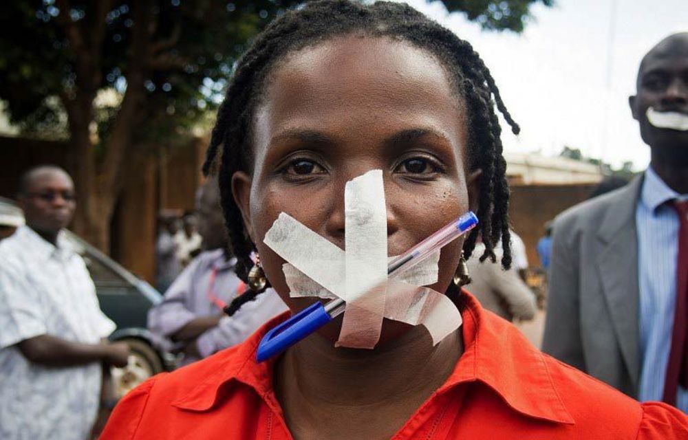 A protester at the Daily Monitor newspaper in Kampala on May 20 2013.