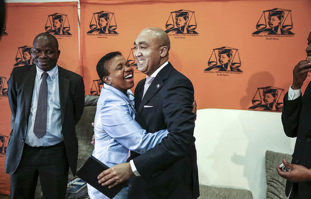 Nomgcobo Jiba hugs Shaun Abrahams after his announcement in May that the high court had dismissed a DA application for an inquiry into her fitness to hold office.