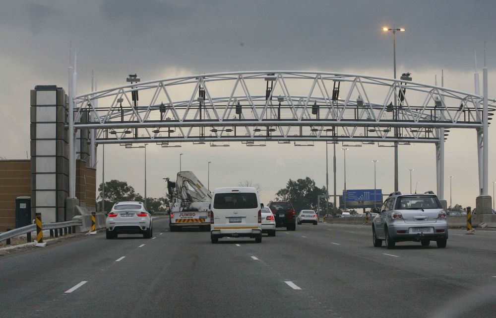 Tuesday marked the start of the e-toll system and motorists trickled in to get tagged. Some are still against it and are willing to be arrested.