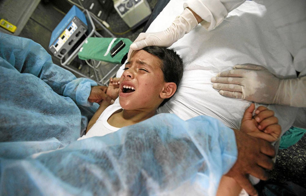 A boy cries while being circumcised at Kouba Hospital in the Algiers. Circumcision is a divisive issue in Europe.