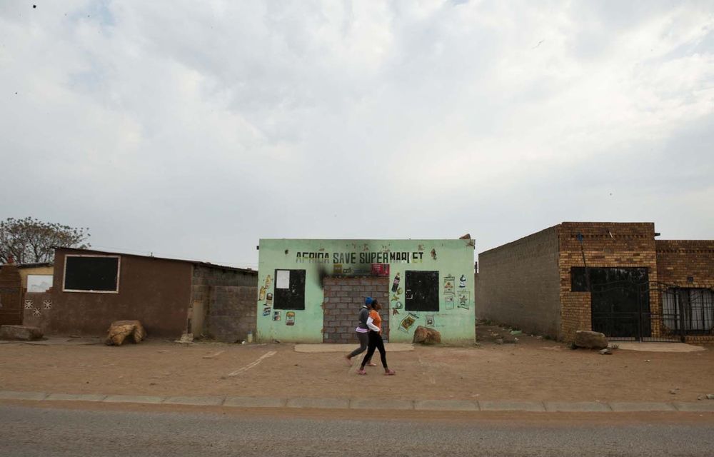 A bricked-up shop after the violence.