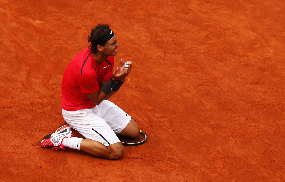 Rafael Nadal of Spain celebrates victory in the men's singles final against Novak Djokovic of Serbia during day 16 of the French Open at Roland Garros.