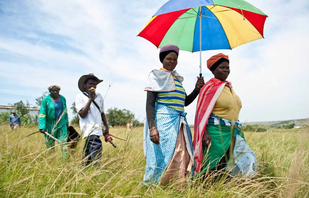 Residents walk to a community meeting on proposed mining in Xolobeni