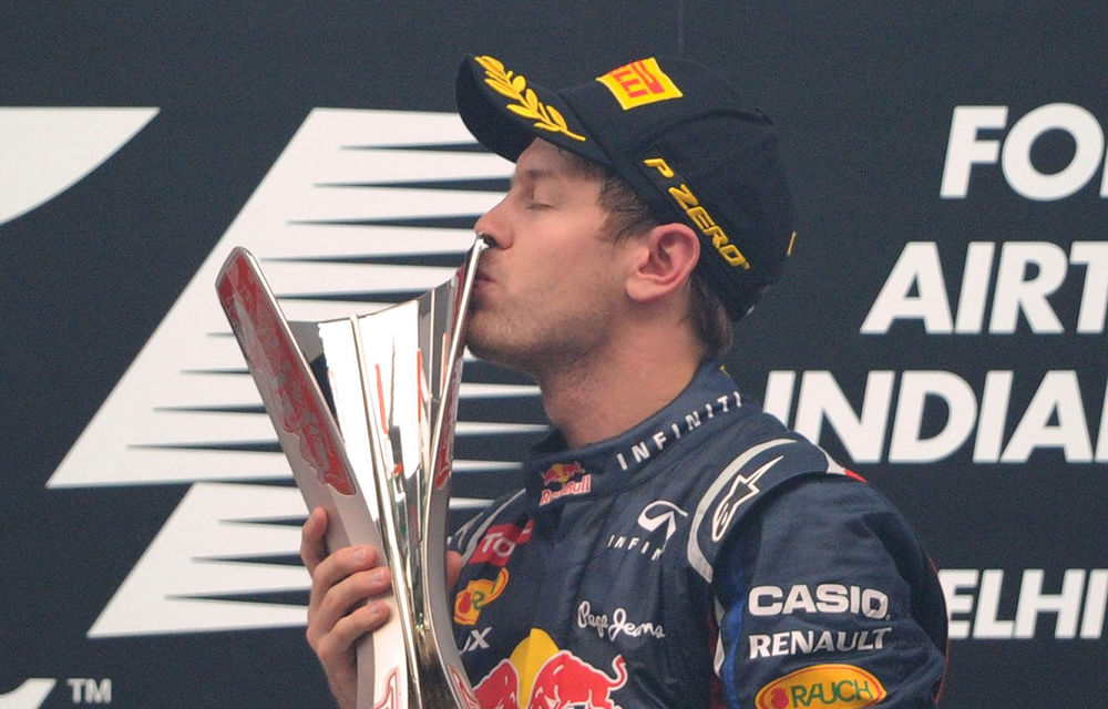 Red Bull-Renault driver Sebastian Vettel of Germany celebrates after victory at the Formula One Indian Grand Prix at The Buddh International circuit in Greater Noida