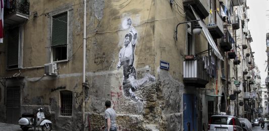 Divine game: A mural by Argentine artist Santiago Spiga depicting modern demigod Diego Maradona ‘s ‘hand of God’
