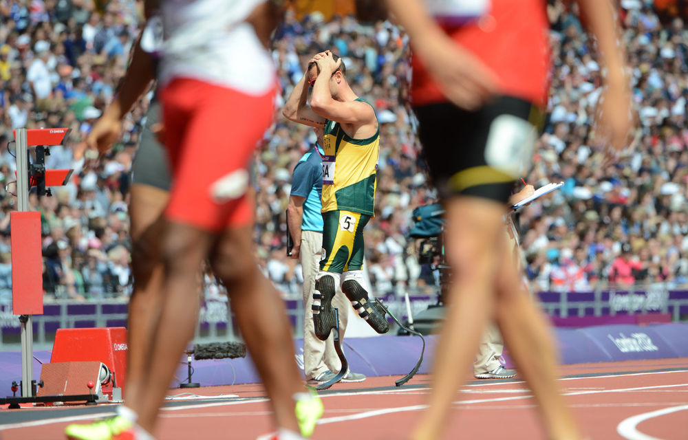 A disappointed Oscar Pistorius leaves the track after the SA 4x400m relay team crashed out of their heat.