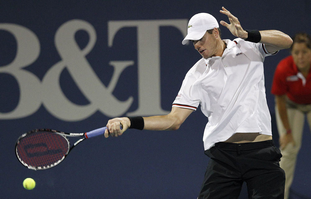 John Isner returns a shot to Jack Sock during the BB&T Atlanta Open at Atlantic Station in Atlanta