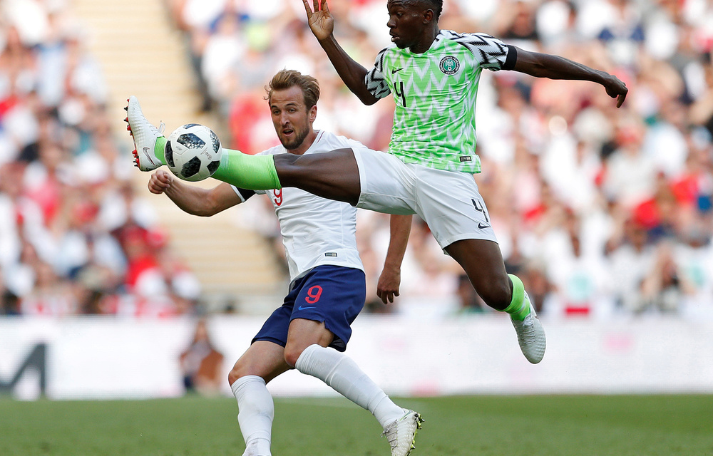 Nigeria's Kenneth Omeruo in action with England's Harry Kane.