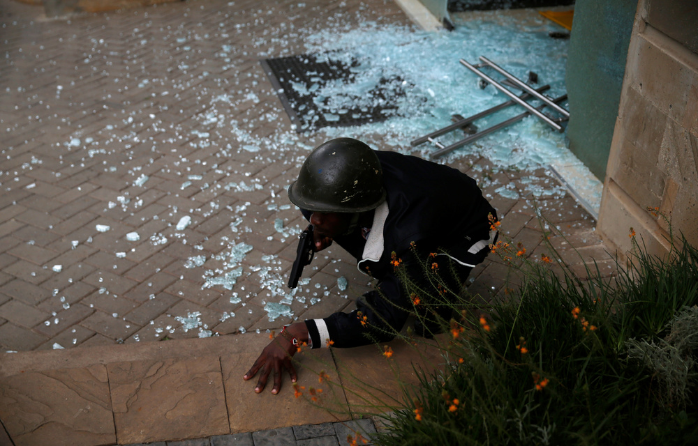 Kenya police scour rubble as hotel attack toll jumps to 21