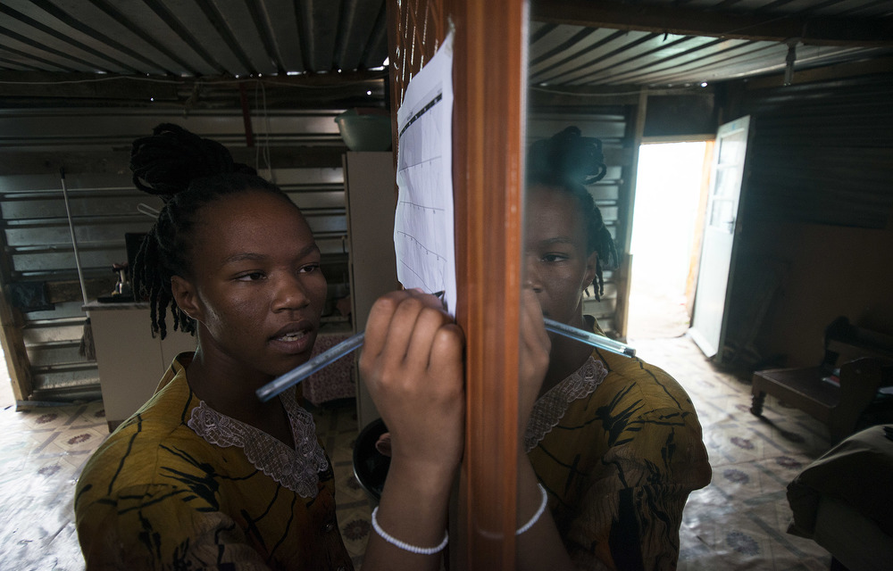 Sold on the idea: Asiphe Ntshongontshi used the family calendar to keep track of when she took the HIV prevention pill. She lives in Masiphumelele outside Cape Town close to a youth centre and clinic