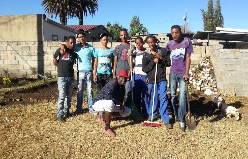 Volunteers clean the busy 8th Lane in Eldorado Park.