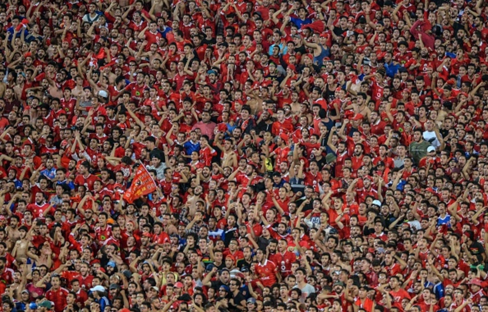 Fans of Egypt's Al-Ahly cheer for their team