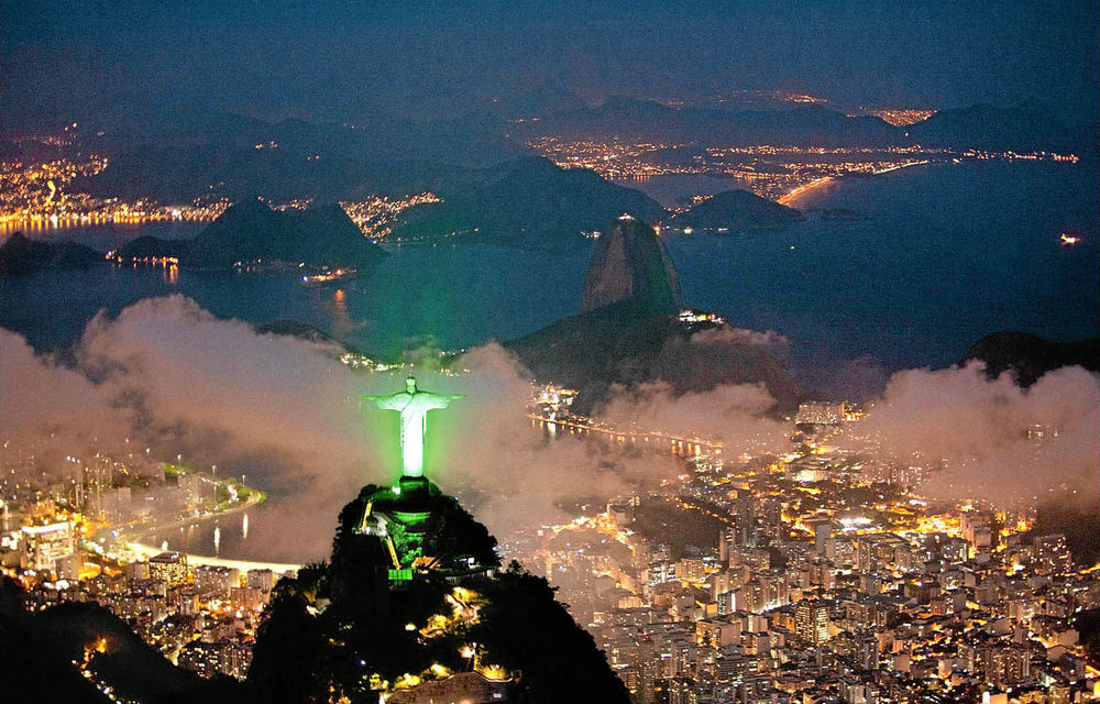 An aerial view of the Christ the Redeemer statue is lit up in green to celebrate the Rio+20 forum in Rio de Janeiro.