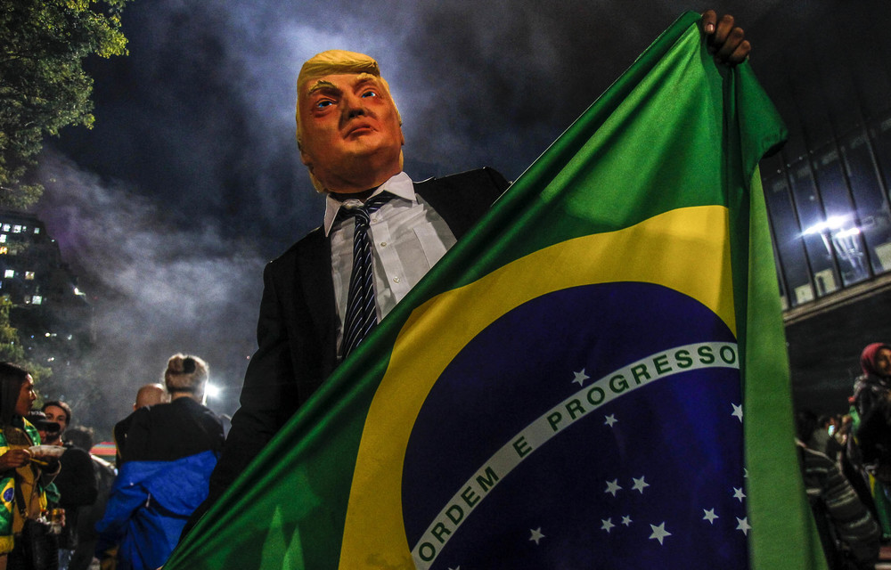 A supporter celebrates Jair Bolsonaro’s victory in Brazil’s elections. The new president has been compared with President Donal Trump