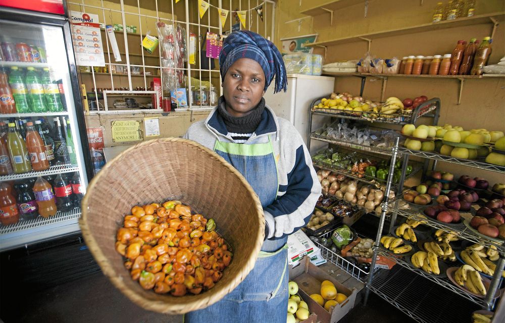 Feel the heat: Consolate Mughemuzi with the habanero chillies that she sells at her shop Get it Green and Fresh in Bez Valley