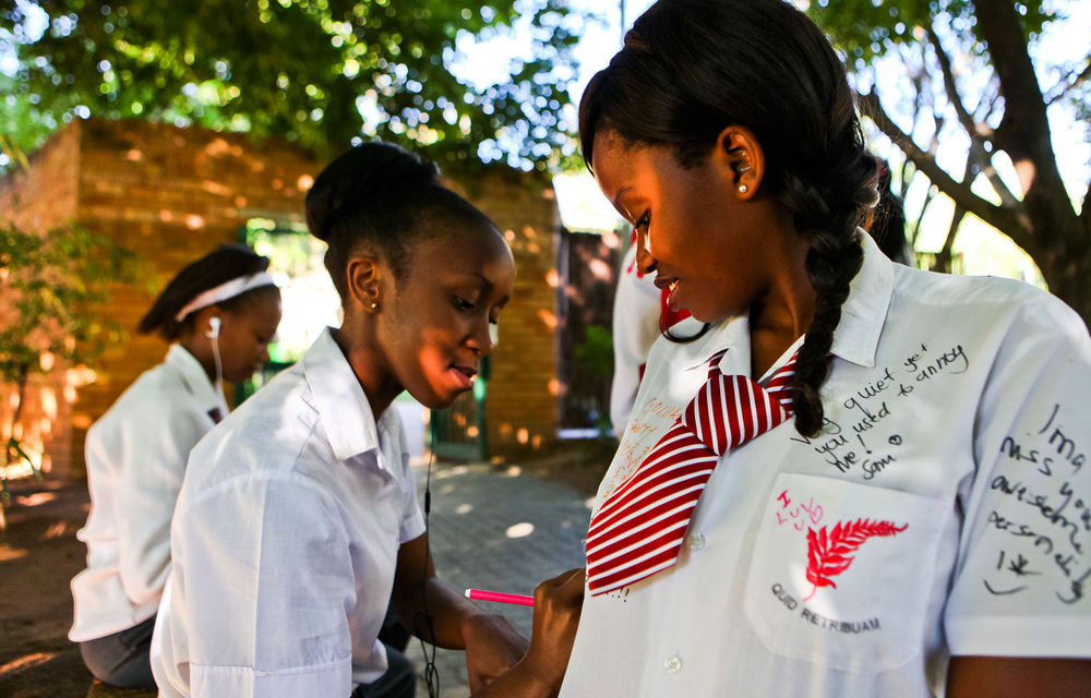 Matric pupils from Ferndale High School sign each others' shirts after writing their final exam.