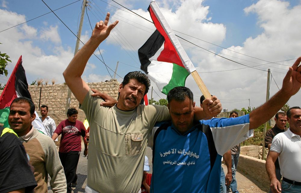 Palestinians from the village of Bil’in protest against an Israeli fence and settlement in Five Broken Cameras