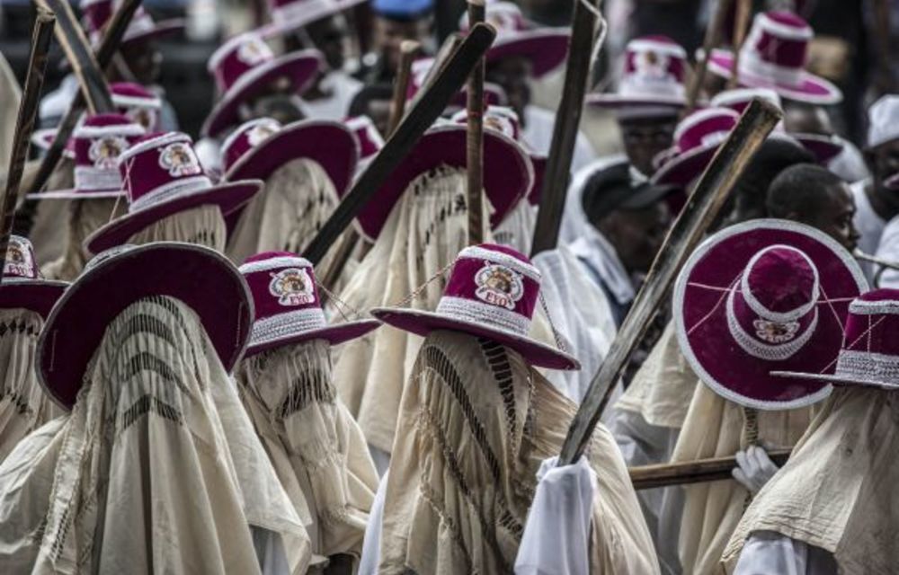 Eyo masqueraders marching in Lagos represent the spirits of the dead.