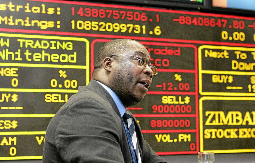 Uncertain times: A broker makes a bid at the Zimbabwe Stock Exchange.