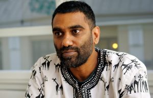 South African climate activist makes a desperate plea for urgent action, kneeling in a protest