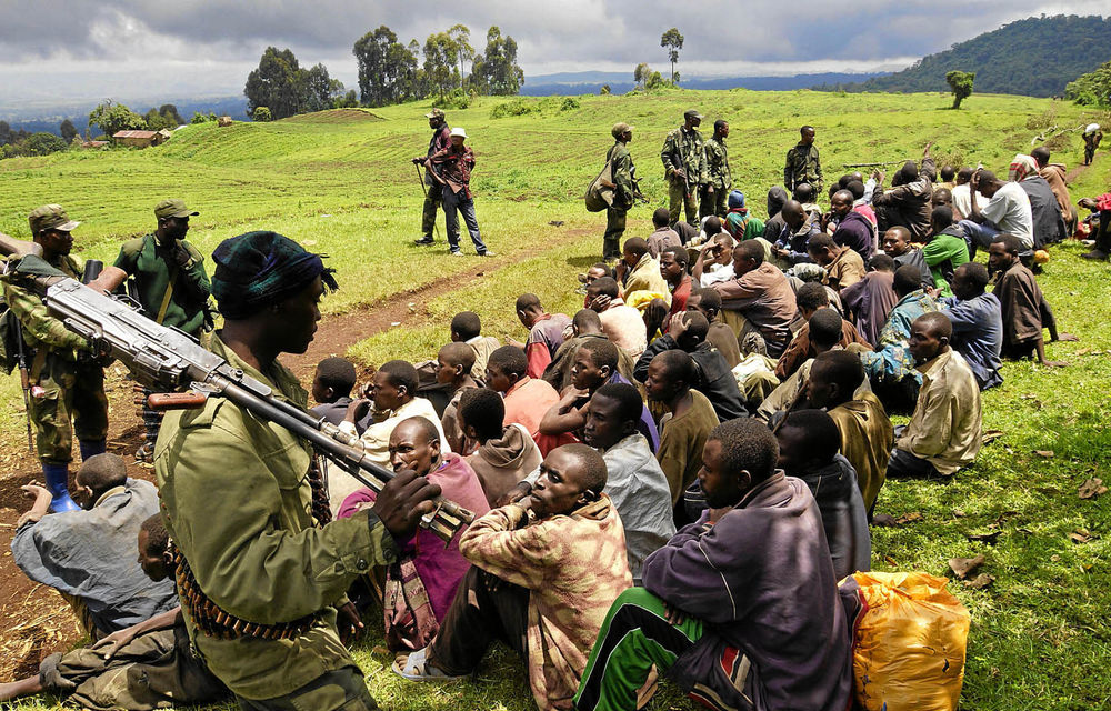 Congolese soldiers guard ­suspected M23 rebels who ­surrendered in Chanzo ­village near Goma.