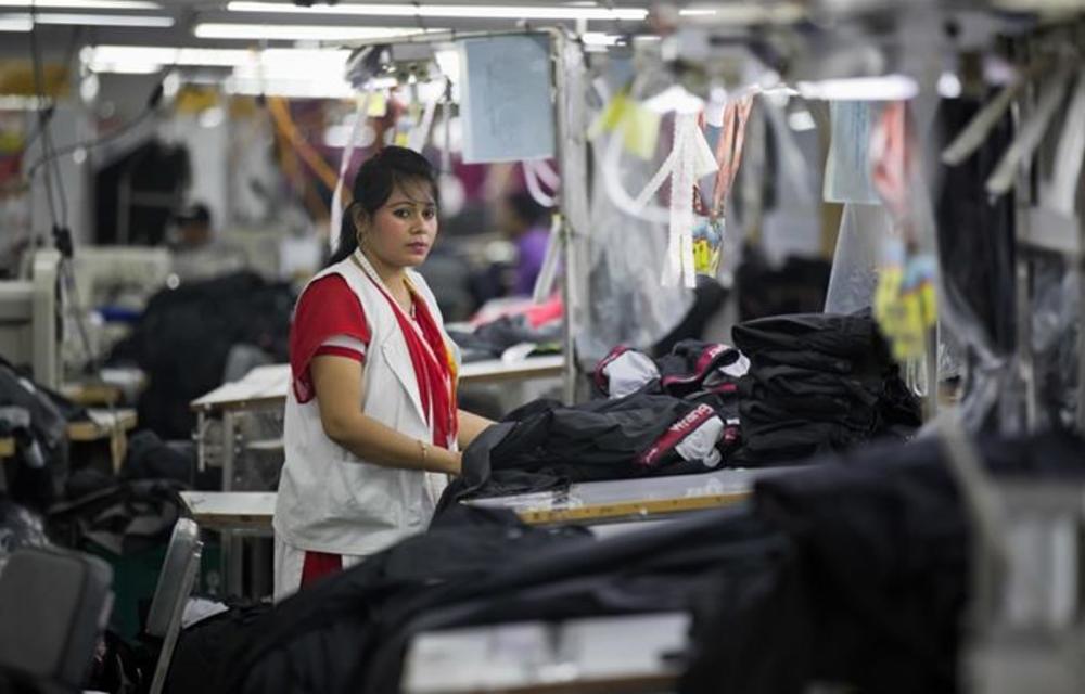 A Bangladeshi woman works at a garment factory in Dhamrai