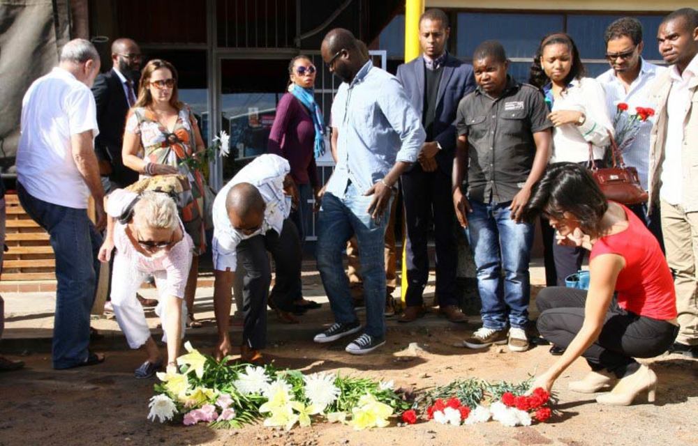 Mourning: Mozambicans pay their respects to Gilles Cistac who was gunned down outside a restaurant on March 3.