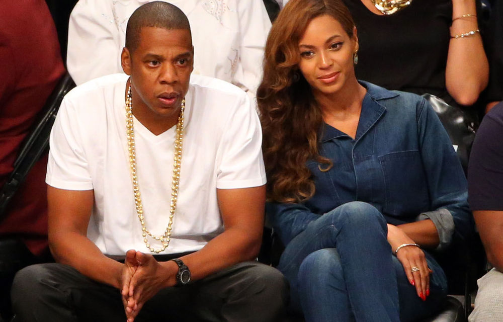 Jay-Z and Beyoncé sitting courtside at the basketball game between the Brooklyn Nets and Miami Heat on May 12.