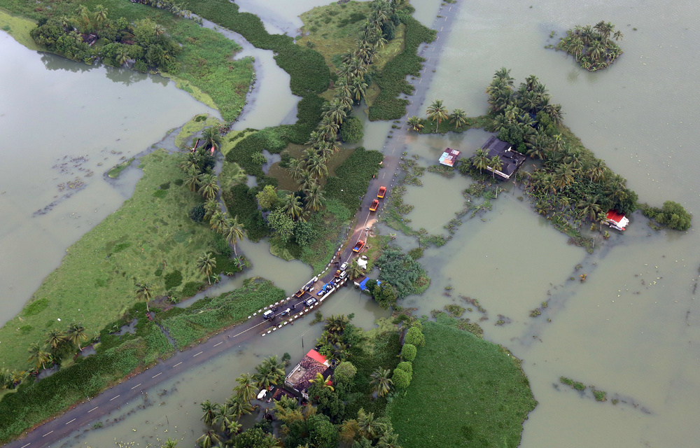 An aerial view shows partially submerged road at a flooded area in the southern state of Kerala