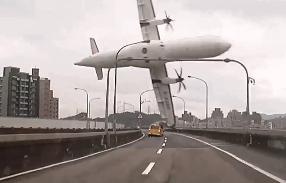 A TransAsia ATR 72-600 turboprop plane clips an elevated motorway and hits a taxi before crashing into the Keelung river outside Taiwan's capital Taipei.